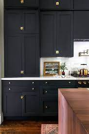 Brass Accents And Ebony Doors Make For A Darkly Dramatic Kitchen Victorian Kitchen Black Kitchen Cabinets Kitchen Renovation