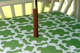 Position the pots over the umbrella hole in the patio table and insert the umbrella. No Sew Patio Tablecloth With Umbrella Hole Pretty Handy Girl