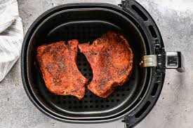 Combine salt, onion powder, pepper and garlic powder and sprinkle over pork chops. Air Fryer Pork Chops Quick Moist Wellplated Com