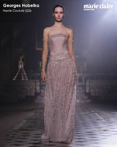 georgeshobeika 's Spring/Summer 2026 collection "L'amour", transforms the  runway into a celebration of romance and elegance. Dreamy gowns float with  delicate, feminine silhouettes, adorned with intricate details and  sparkling embellishments. Each piece