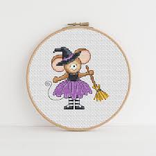 Counted cross stitch patterns are not just a great craft to enjoy but it can provide the perfect gift and even a memento of history. Furry Tales Witch Mouse Cross Stitch Pattern Lucie Heaton