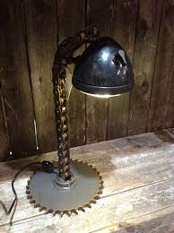 Design Lighting Ideas Tractor Lamp Utilizing Chain And A Sprocket Lamp Steampunk Lighting Steampunk Lamp