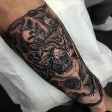 The tiger is considered the lord of the jungle within indian culture and it's no wonder why this powerful animal has garnered similarly to traditional panther tattoos, a tiger can be designed in a crawling stance or with a number of other motifs. Traditional Tiger Head Tattoo Black And Grey Novocom Top
