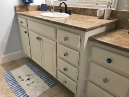 While there is no set rule, we generally recommend that the pull length is approximately 1/3 of the cabinet or drawer width. Busy Geemaw Bathroom Cabinet Knob Update