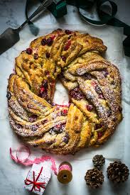 So here's a bread wreath you can make to help decorate your table, as well as fill your guests! Christmas Cranberry White Chocolate Wreath Donal Skehan Eat Live Go