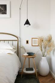 A Cozy And Minimal Bedroom With A Vase Filled With Pampas Grass For Texture Home Decor Bedroom Home Decor Inspiration Bedroom Interior