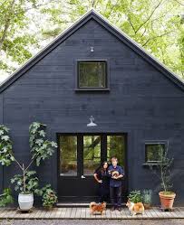 Black paint is great at highlighting architectural design while also complementing its outdoor spaces. 12 Dark Blue Houses Ideas House Colors House Exterior House Painting