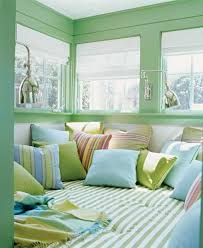This triangular paint feature creates a cosy corner, almost like a canopy over the bed. Pastel Blue And Green Colors Creating Tender And Airy Interior Decorating