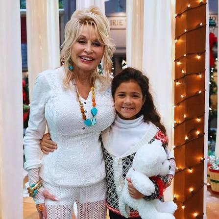 Given that Dolly Parton is playing an angel in a Christmas special, it's  only fitting that she saved a little girl's life while the two were on the movie  set.