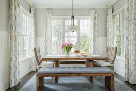 A vintage farmhouse entryway with light blue beadboard, pendant lamps, a basket box and much natural light. Dining Room Beadboard Design Ideas
