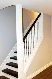 Much Ado About Trim Attempts At Domestication Basement Staircase Open Basement Stairs Basement Living Rooms