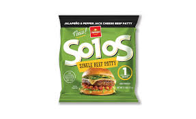 Hamburger patties cooking on a charcoal grill. Single Serve Hamburger Patty 2019 08 14 Refrigerated Frozen Foods