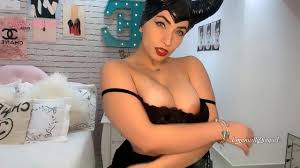 Maleficent cosplayer sexy perfect butt brunette in tight black latex dress  dirty talking in JOI style, while teasing with her big butt and suckinh her  toy, asking for some milk in her