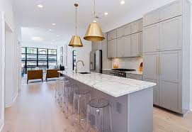 Kitchen With Light Gray Cabinets Gold Door Hardware And Quartz Countertops In 2020 Contemporary Kitchen Contemporary Kitchen Cabinets Grey Kitchen Cabinets
