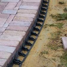 Using a garden trowel, pour polymeric sand into the spaces between the edging (image 1). Gator Edge Paver Landscaping Edging Lawn Garden Niemeyer
