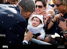 U S President Barack Obama Greets A Crying Baby In The Crowd At The Chicago O Hare International Airport May 22 2014 In Chicago Illinois Stock Photo Alamy