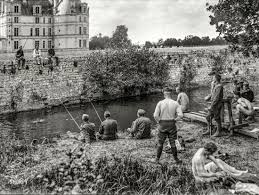 September 1918. Shell Shock patients having a happy time fishing and  swimming under the walls of the old chateau. These American soldiers are  recovering from war neurosis, as the scientists now call