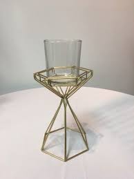 You can also explore thousands of other home accents like bookends and vases to match. Geometric Short Gold Candle Holder W Glass Votive Holder Affordable Elegance Inc