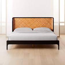 A cane bed is a chic and timeless choice for a bedroom. Miri Black And Rattan Bed Cb2