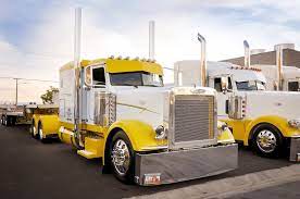 where are all of our yellow fans a couple of great looking peterbilts owned by s t s always great to see these trucks rolli trucks big rig trucks big trucks