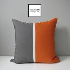 This chic decorative pillow has a pop of shimmer, and its bright hue will create visual drama. Orange Grey Outdoor Pillow Cover Decorative Color Block Mid Century Modern Outdoor Pillow Outdoor Pillow Covers Grey Outdoor Pillows Modern Outdoor Pillows