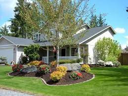 A simple frontal pathway with lush green lawn from both side and a touch of flower bed give a perfect landscaping recipe for the front of your home. 30 Awesome Flower Garden Design For Your Front Yard Teracee Farmhouse Landscaping Front Yard Landscaping Design Home Landscaping