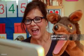 Karen Carter teaches 4&5 year olds at Bushnell Way elementary school...  News Photo