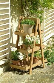 Make this beautiful diy wooden outdoor plant stand for multiple plants with just a few simple steps. Diy Flower Stand Turn An Old Wooden Ladder Into A Flower Decoration Diy Plant Stand Plant Stand Indoor Plant Stands Outdoor