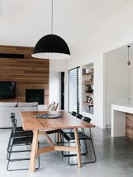 Contemporary Dining Room With Wooden Table Minimalist Black Dining Chairs Pendant Lighting Minimalist Dining Room Dining Room Contemporary Dining Room Design
