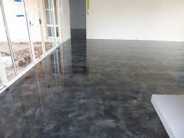 Resin flooring is a tough and durable plastic surface produced with a mixture of constituents in a controlled chemical reaction. Resin Floor Silver And Black Epoxy Floor Flooring Concrete Decor