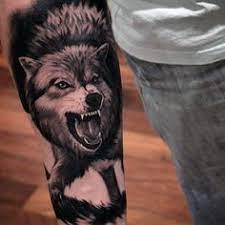 50 Realistic Wolf Tattoo Designs For Men Canine Ink Ideas Tattoo Designs Men Realistic Wolf Tattoo Realistic Wolf Tattoo Design