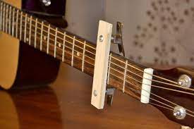 Homemade Capo Guitar Ehow Guitar Guitar Capo Playing Guitar
