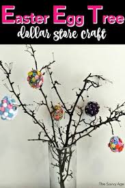 Nestle faux robin's eggs in moss, attaching with glue. Dollar Store Easter Egg Tree The Savvy Age