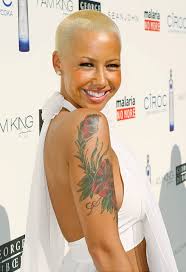 Wiz khalifa has a tattoo on his eyebrow which is a nautical symbol, that is a star. Amber Rose Tats Wiz Khalifa S Face On Her Arm Lethirst