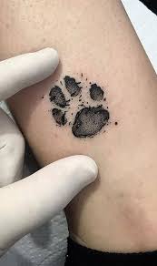 Some dog lovers choose to use fido's paw print as a main feature of their artwork in honour of their beloved pooch and as a means of signifying their love and deep connection with their pet. 50 Adorable Dog Paw Tattoos And Ideas To Pay Homage To Your Furry Friend Tattoo Me Now
