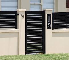 Exterior Boundary Wall Designs Google Search Metal Garden Gates Fence Gate Design Brick Wall Gardens Reflect a range of natural brown shades by mixing a low stone wall with brick columns and stained wooden slats. exterior boundary wall designs google