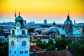 Munich Altstadt At Yellow Sunset Haze With Mullersches Volksbad Clock Tower And St Lukas Church Germany Dream Travel Destinations Clock Tower Germany