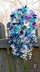 The bridal bouquet, with real touch calla lilies, roses, orchids and tiger lilies in royal blue and purple, about 10inch×17inch, usd120. Dress My Wedding Cascading Blue Orchid Bouquet With Turquoise And Purple Accent