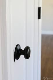 Update Your Doors White Craftsman Style The Diy Playbook Craftsman Style Doors White Interior Doors White Door Black Hardware