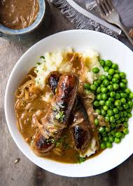 We've flavoured this meaty sausage and onion pie with marmite, for a salty, tangy kick, then topped it off with cheesy mash. Bangers And Mash Sausage With Onion Gravy Recipetin Eats