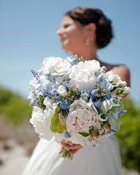 Available in a variety of colors, hydrangeas are a beautiful statement in any wedding globe thistle and hydrangeas are stunning blue accents to the peach flowers in this wedding bouquet. Bouquet Of White Peonies Light Blue Hydrangea Blue Muscari White Spray Roses Silver Brunia Berries And To White Spray Roses Blue Hydrangea Bouquet Wedding
