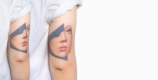 Beautiful young woman tattoo artist portrait with tattoo machine against tattoo ink bottles. 13 Best Tattoo Artists Of 2015 Editor S Picks Scene360