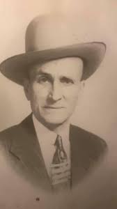 My grandfather, A.W.Midkiff of Greenwood Avenue in Hot Springs, Arkansas.  He was a justice of the peace, sold musical instruments in a shop behind  his house and at one time was a