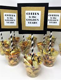 Find unique retirement party ideas here Easy Retirement Party Centerpiece Cheers To The Golden Years Candy Cups Retirement Party Centerpieces Retirement Party Gifts Retirement Party Decorations