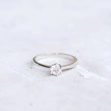 Small And Cute This Engagement Ring Features A Single Small Round Cubic Zirconia In Center M Small Engagement Rings Small Wedding Rings Wedding Rings Simple