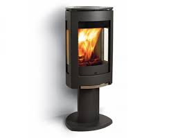 A new generation of wood stoves offers fuel efficiency, high combustion temperatures, and lower above: Jotul F 370 Modern Wood Burning Stove
