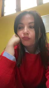 Person in Red Sweater Relaxing Indoors