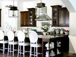 This kitchen design in a whole house remodel in palo alto started with the sunburst kitchen clock. Elegant White Kitchen Remodel Before During And After Randi Garrett Design