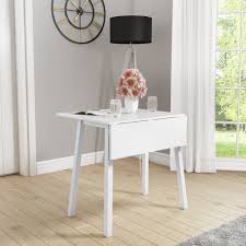 Two or 4 sides of the wood desk are connected to the middle portion of the desk. New Haven White Drop Leaf Space Saving Dining Table Furniture123
