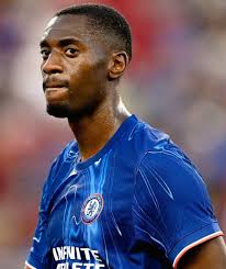 WHAT IS TOSIN LOOKING AT FOR ABOUT 5 TO 6 SECOND'S THIS GUY MUST BE A GENIUS